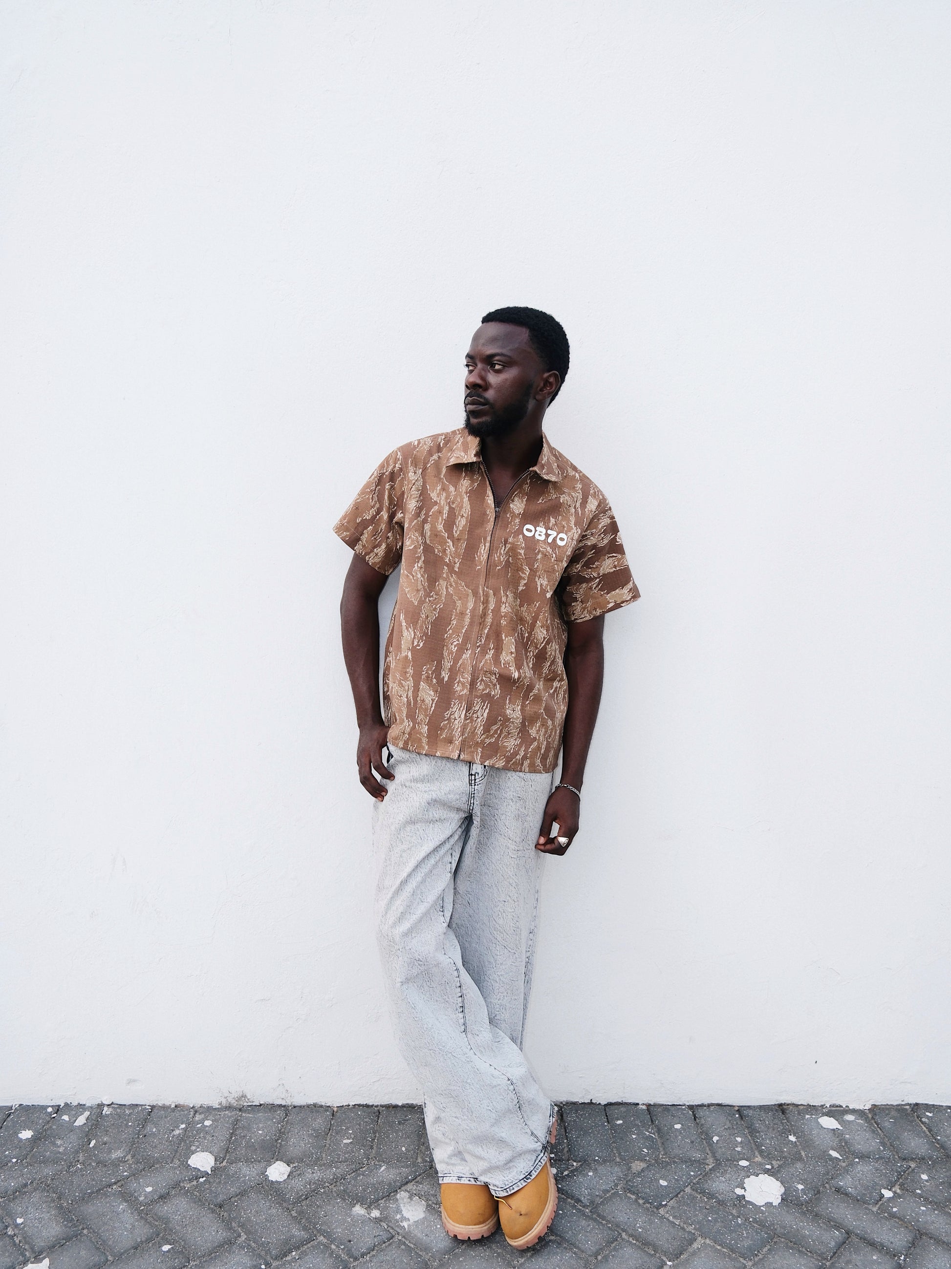 Brown Camouflage short sleeve shirt o a model