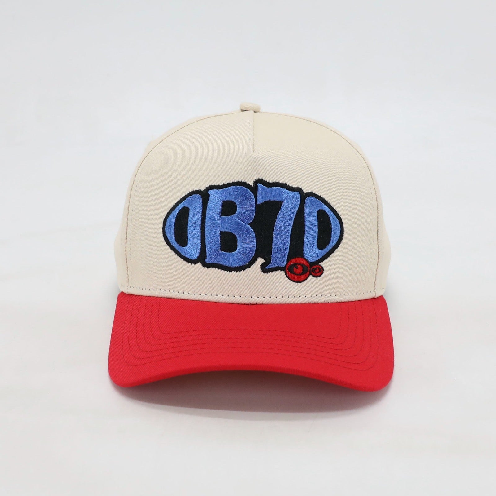 Front view of OB70 Crème baseball cap