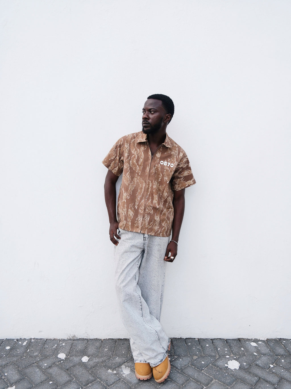 Brown Camouflage short sleeve shirt o a model 