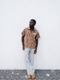 Brown Camouflage short sleeve shirt o a model 