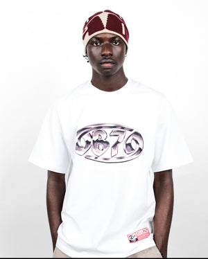 Person wearing an OB70 Crab Logo T-shirt & OB70 logo beige beanie.
