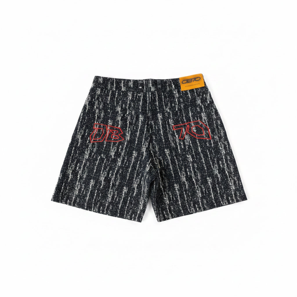 Black patterned DENIM shorts with red OB70 Embrodried logos on a white background