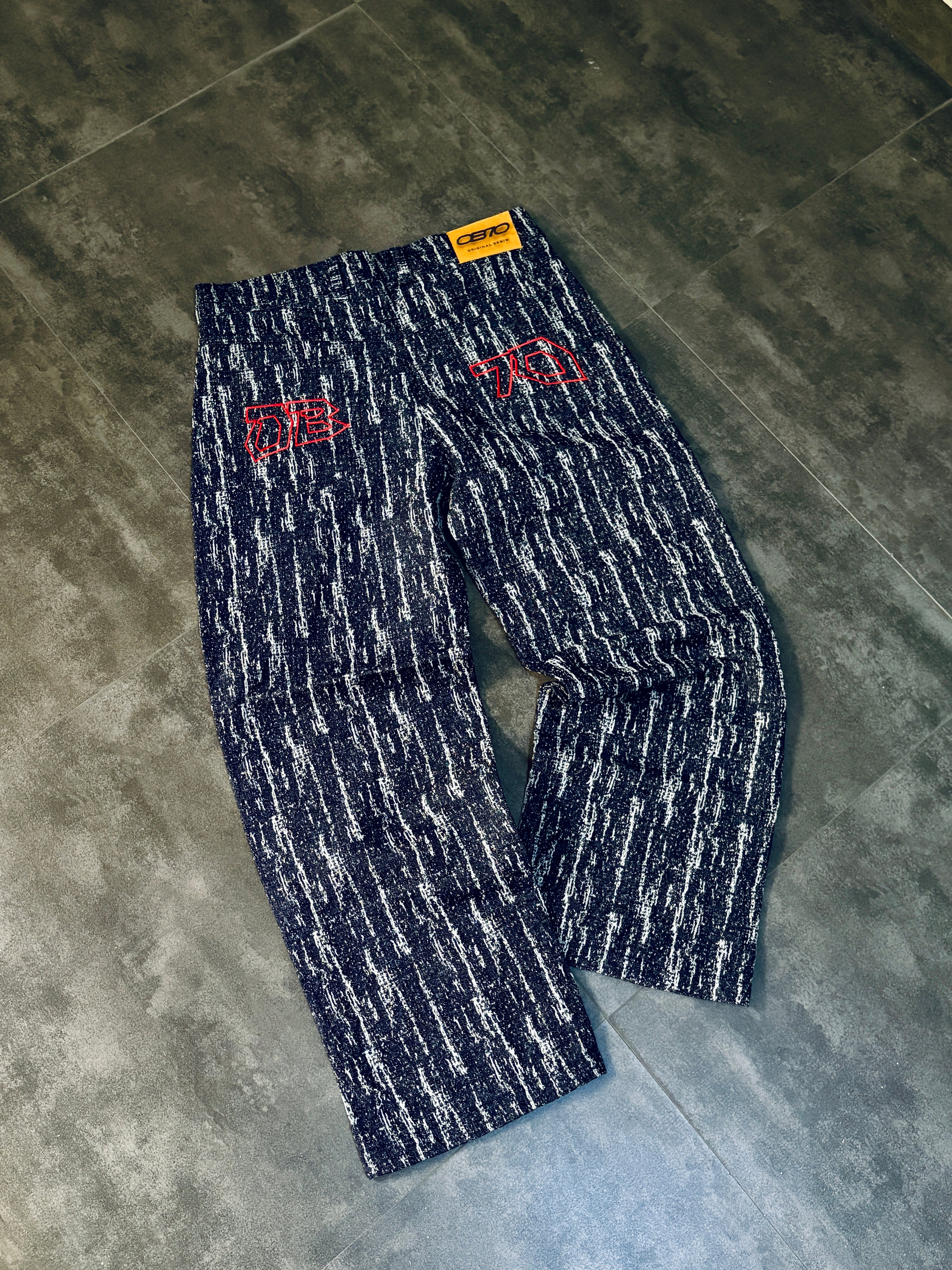 Pair of patterned pants on a concrete floor